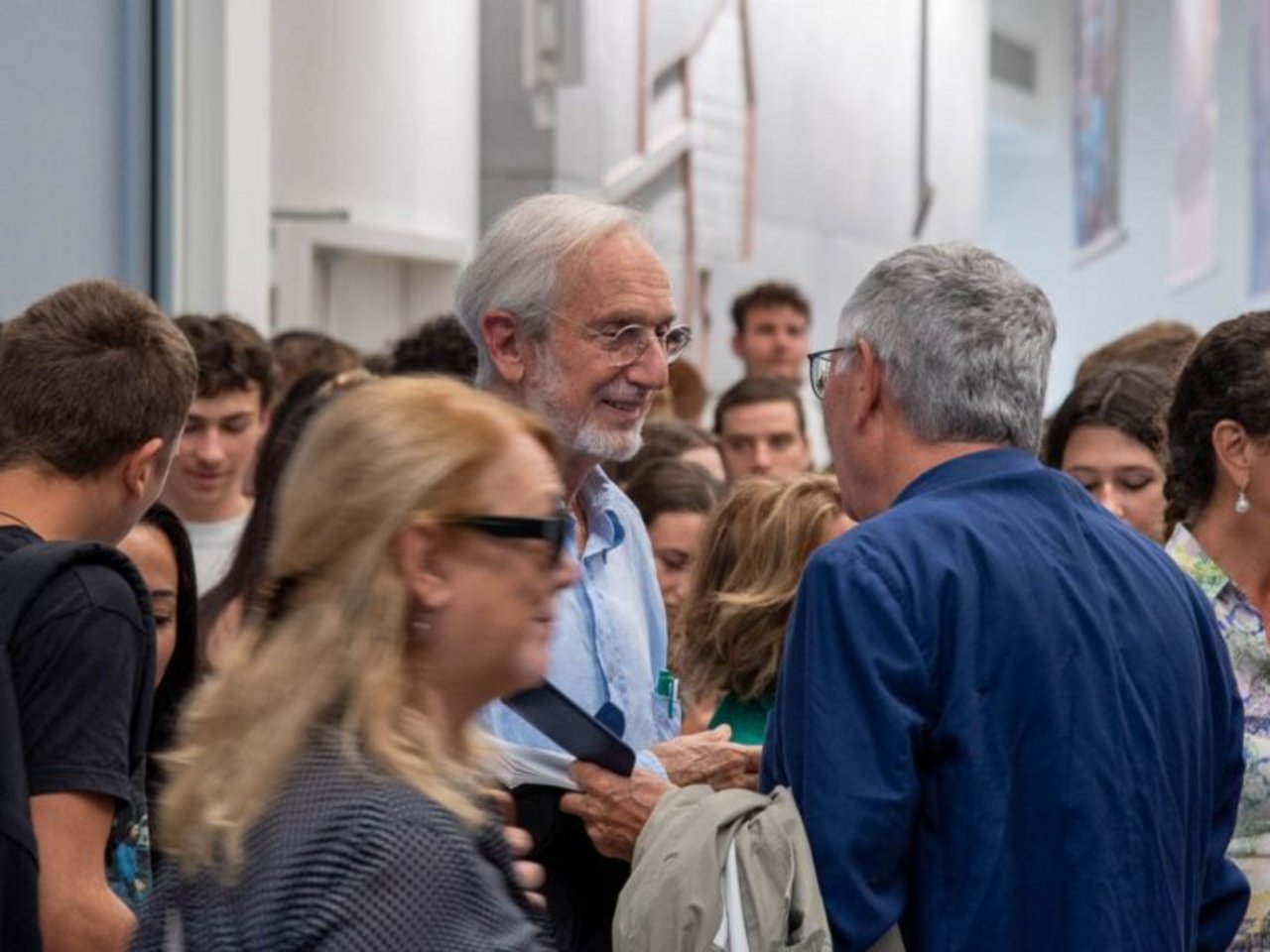 Pubblico in aula magna che assiste a una lezione di Renzo Piano