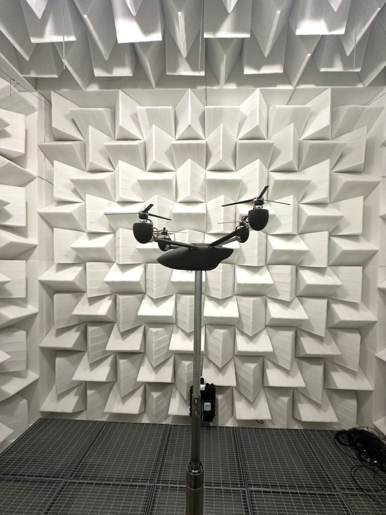 Four-rotor drone model inside the Anechoic Wind Tunnel