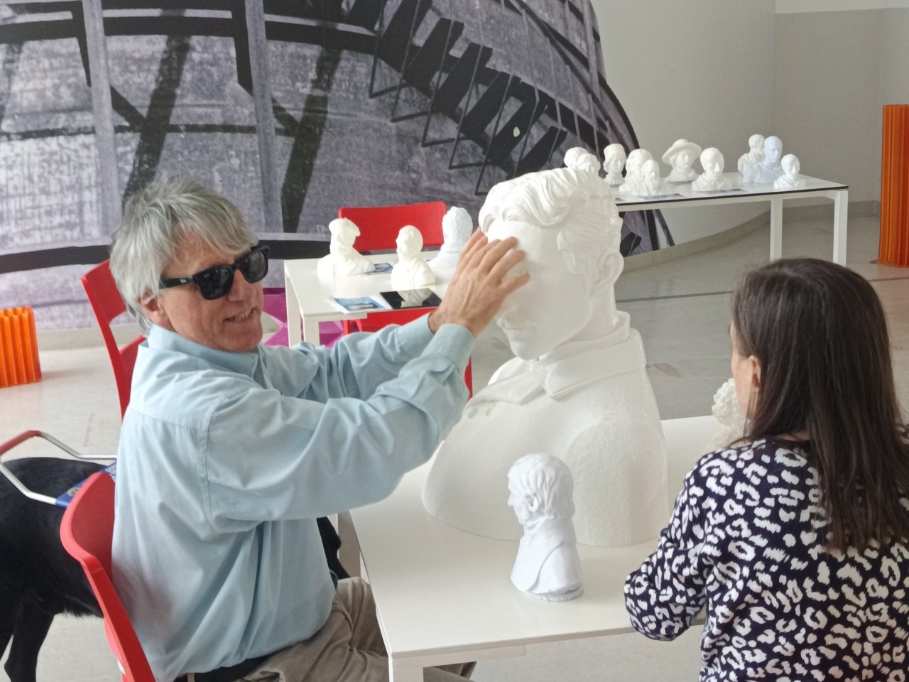 A visually impaired man explores a 3D-printed bust by touch, Plastic-IndexLab project, INDEXLAB Politecnico di Milano.