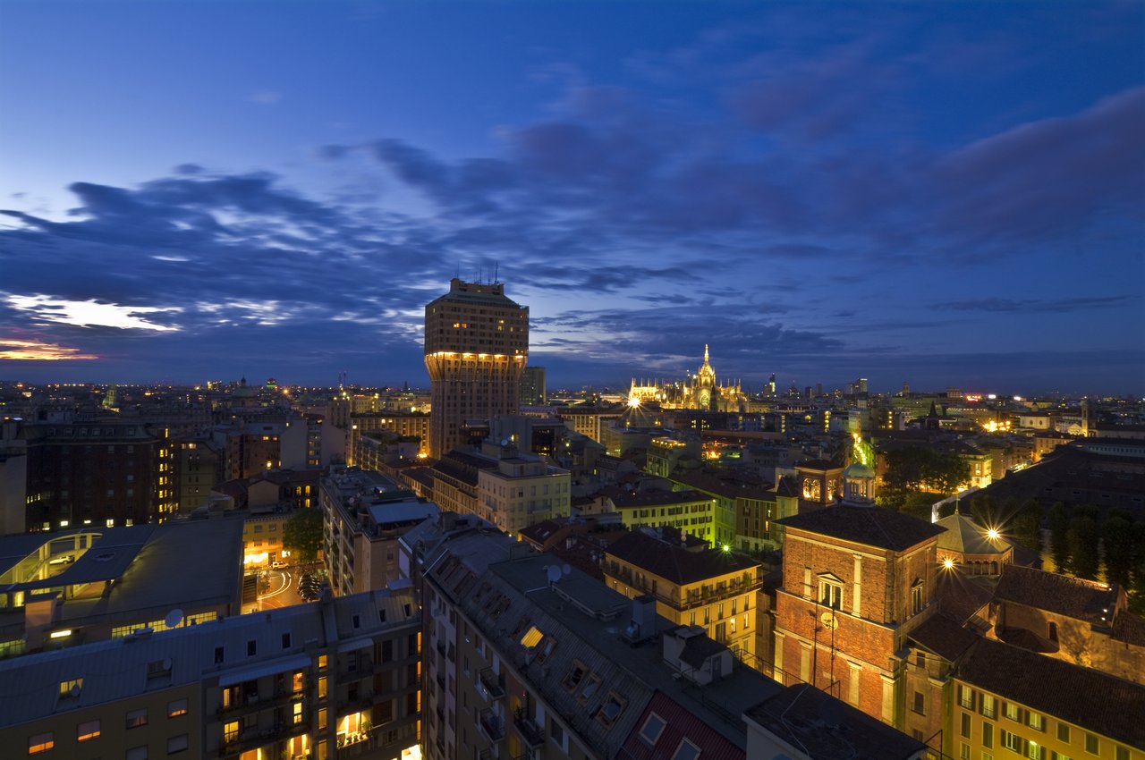 Milan skyline at night with a view on Velasca Tower.