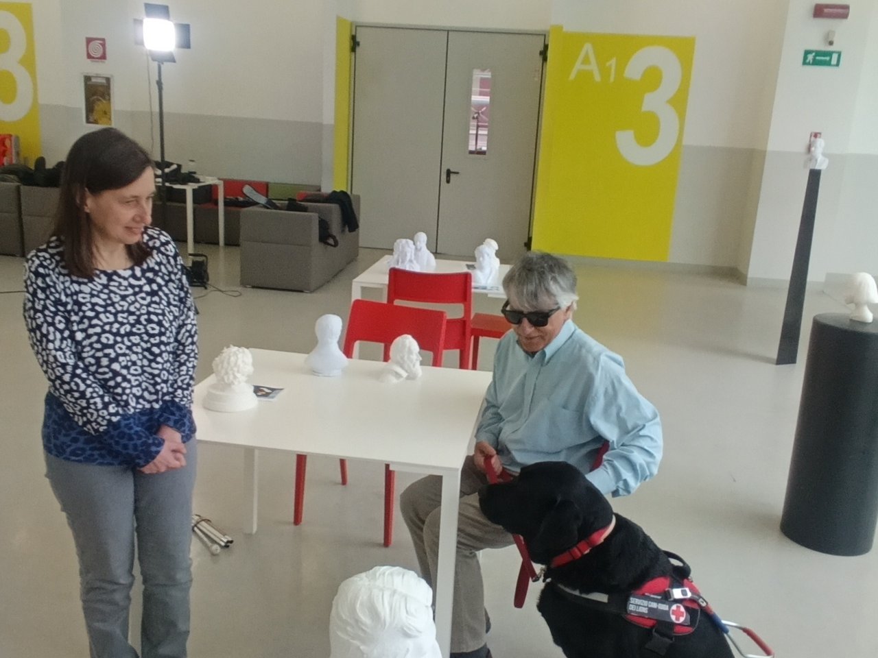 Welcome of a visually impaired participant with guide dog, Plastic-IndexLab project, INDEXLAB Politecnico di Milano.
